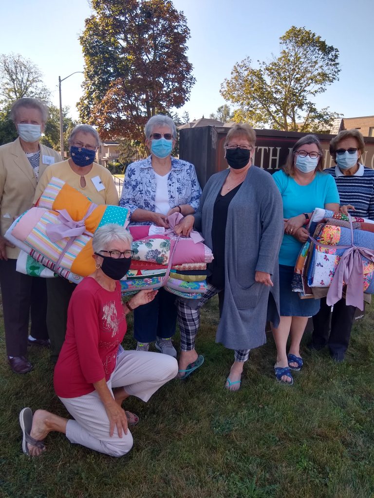 Pictured are a few sewers (l-r) Donna Slote, Inge Storjohann, Jeanne Boulé, Teri Watson (Helping Hands) Kristine Taylor, Irene Leonhardt, and (front) Liz Mongeon.